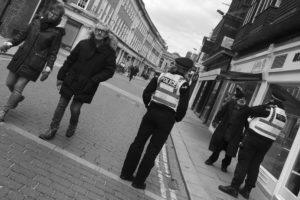 Police talk to man in street, York