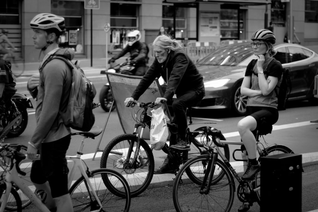 Cyclists wait at traffic lights, London