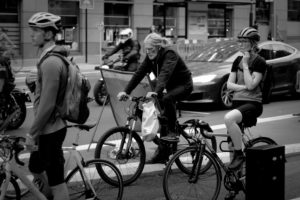 Cyclists wait at traffic lights, London