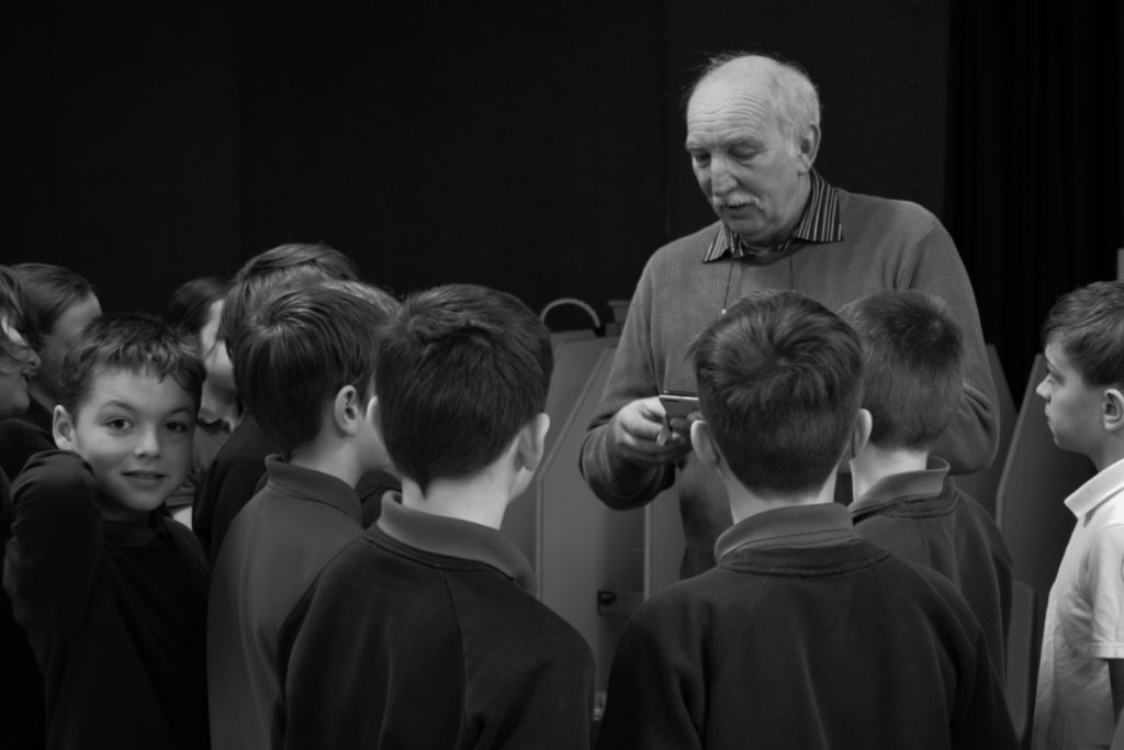 School pupils learning about pigeon racing from Kirkbymoorside Flying Club member Fred