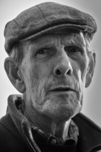 Portrait of pigeon owner Bob wearing flat cap, Kirkbymoorside, North Yorkshire