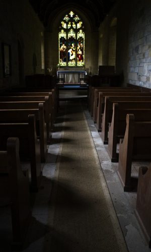 Church interior with wooden pews