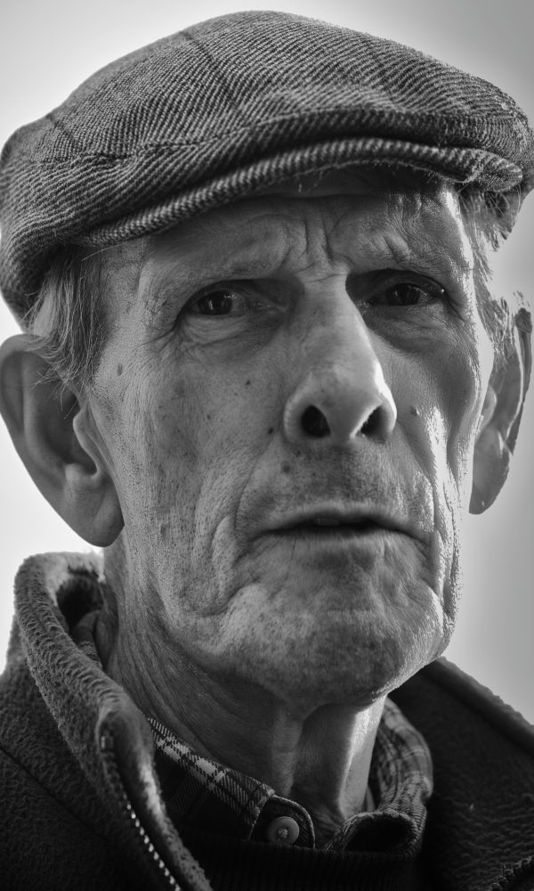 Portrait of pigeon owner Bob wearing flat cap, Kirkbymoorside, North Yorkshire